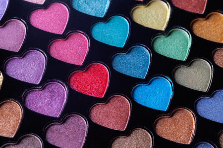 Heart Shaped Eyeshadow Set. Eyeshadow palette with colorful heart shaped refills close-up. Macro eyeshadow.の写真素材