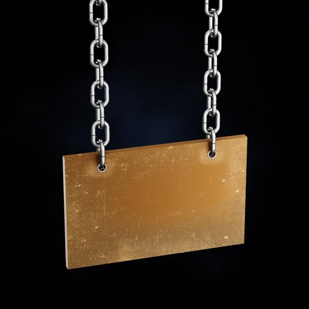 Scarred old board hanging on the iron chainsの写真素材