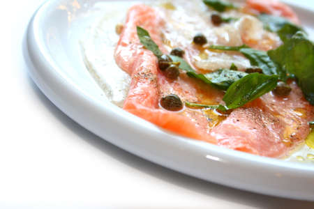 mediterranean fish based dish isolated on ehite backgroundの写真素材