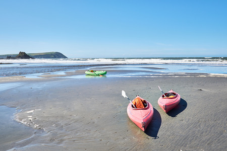 Canoes on Newport Sands, Newport Bay, Pembrokeshire, Dyfed, Wales, UKの写真素材