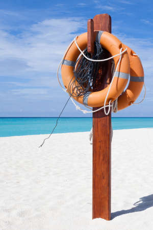 Alert sign on a white beach in Maldive Islandsの写真素材