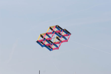 Kite flying in the blue skyの写真素材