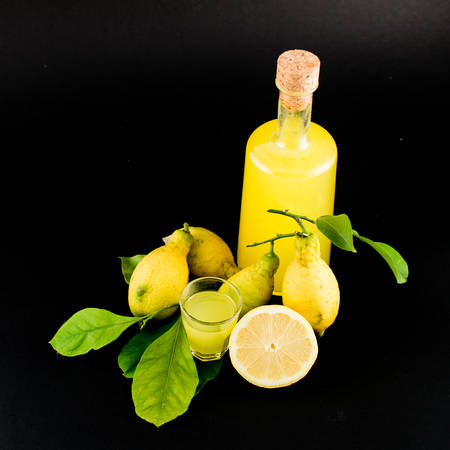 "Limoncello" is the traditional liqueur distilled from the peel of lemons (called sfusato amalfitano) produced in all the Coast of Amalfi until Sorrento. It's a natural liqueur, with special properties, a unique taste, perfumed, obtained by an ancient andの写真素材