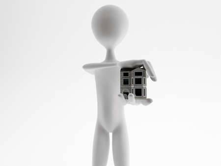 man showing an house model in his handsの写真素材