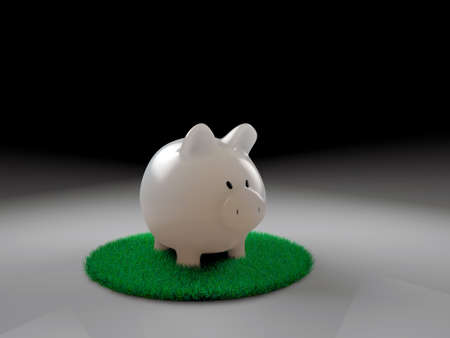 piggy bank on green grassの写真素材