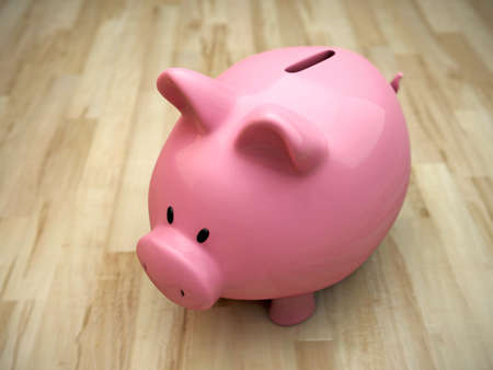 piggy bank on wooden floorの写真素材