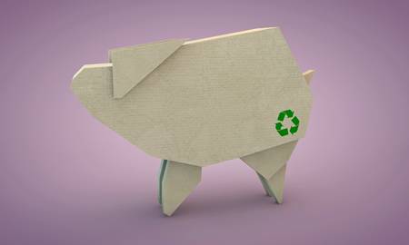 cardboard shaped like a pig isolated on pink backgroundの写真素材