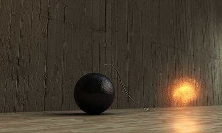 exploding bomb on wooden parquetの写真素材