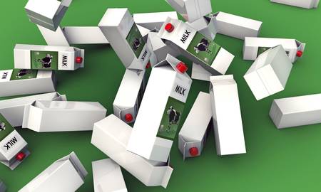 milk packages falling down on green backgroundの写真素材
