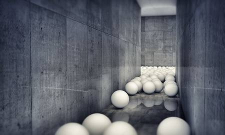 white balls along a concrete corridorの写真素材