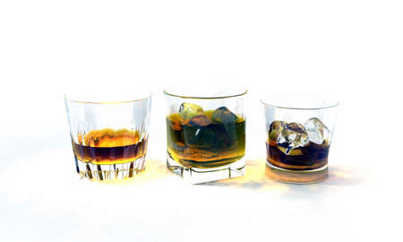 whiskey glasses isolated on white backgroundの写真素材