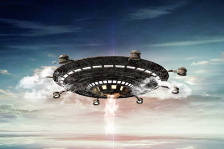 3d illustration of a rusty ufo in the skyの写真素材