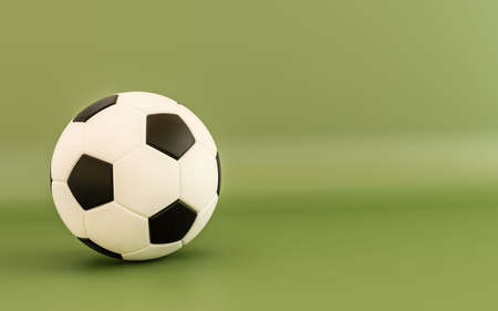 3d illustration of a soccer ball isolated on green backgroundの写真素材