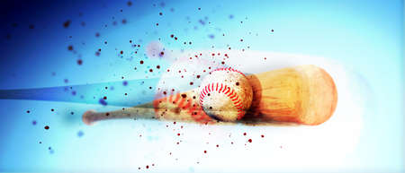 wooden baseball bat hitting a ball isolated on blue backgroundの写真素材