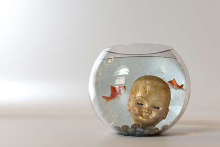 doll head into a fishbowl isolated on white backgroundの写真素材
