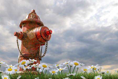 3d illustration of a rusty hydrant on green grassの写真素材