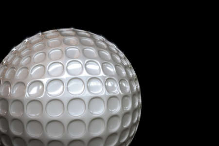 3d illustration of a golf ball isolated on black backgroundの写真素材