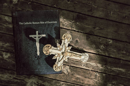 3d illustration of the exorcism book on wooden floor の写真素材