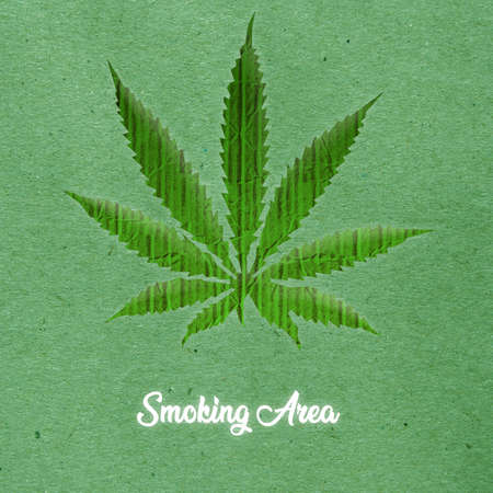 marijuana leaf isolated on green backgroundの写真素材