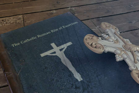 exorcism book on wooden floor 3d illustrationの写真素材
