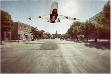 aeroplane landing on a empty street 3d illustrationの写真素材