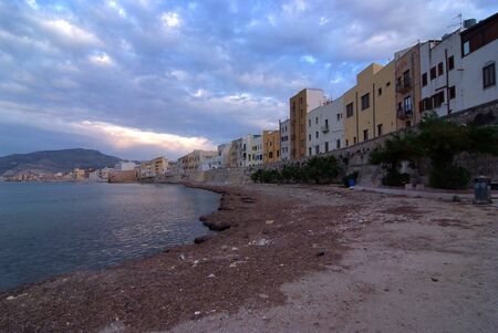 coast sprinkled with seaweed near Trapaniの写真素材