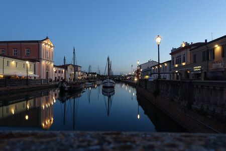 tourist canal of Cesenatico at sunsetの写真素材