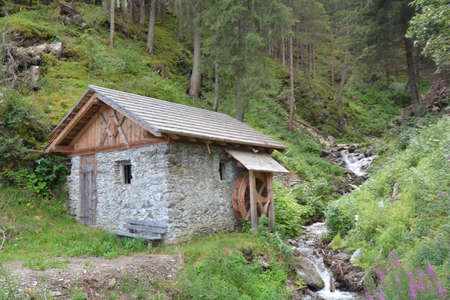 small house on the edge of the Val Pusteria streamの写真素材