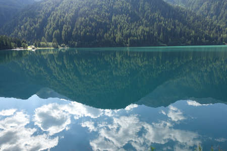 Antholz lake reflection of the mountain in the waterの写真素材