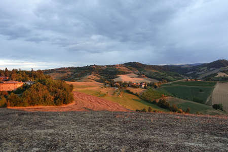 sunset on the hills of Fogliano city of Maranelloの写真素材