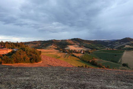 sunset on the hills of Fogliano city of Maranelloの写真素材