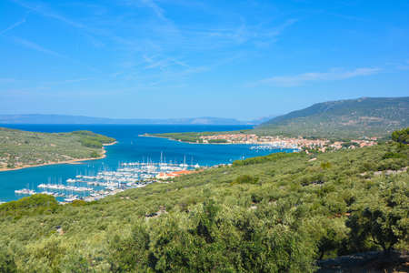 coast around the island of krk overlooking the marinaの写真素材