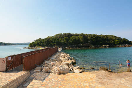 bridge connecting the coast to an islet in istria near the city of vrsarの写真素材