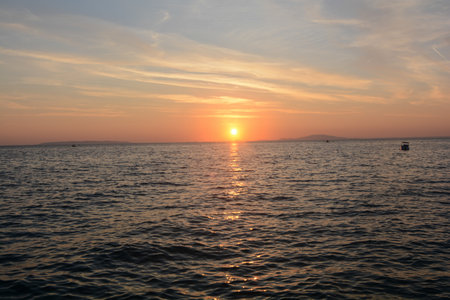 sunset over the sea in Novaljia island of Pagの写真素材