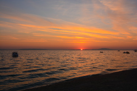 sunset over the sea in Novaljia island of Pagの写真素材