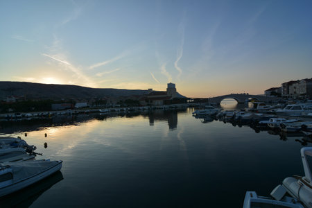 sunset of the city of pag capital of the island of pagの写真素材