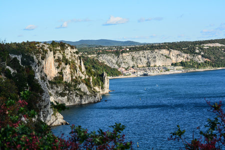 sistiana bay near trieste imposing cliffs overlooking the sea disfigured by the buildings on the seaの写真素材