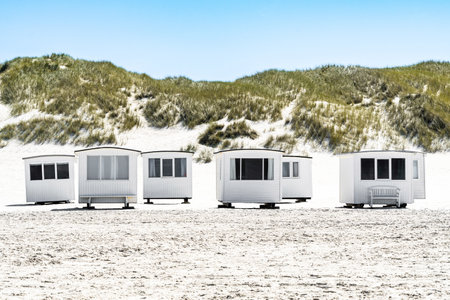 Front view of the bathhouses at LÃ¸kken beach, with the dunes in the background, horizontalの写真素材