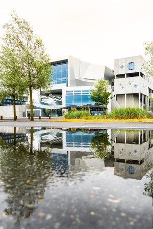 The House of Music in Aalborg reflected in a puddle, verticalの写真素材