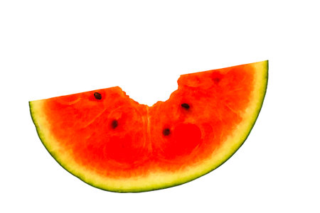 Piece of watermelon bitten in half, white background, horizontalの写真素材