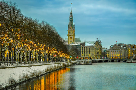 View along the Christmas-lit Ballindamm towards the town hall in Hamburg, reflections in the water, horizontally, verticallyの写真素材