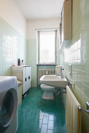 Simple, old bathroom in normal apartmentの写真素材