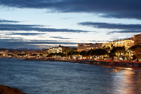 Cannes illuminated coast and Croisette view in the evening on July 29, 2015 in Cannes, France. The city is a luxury tourism destination with many hotels and high level shops.のeditorial素材
