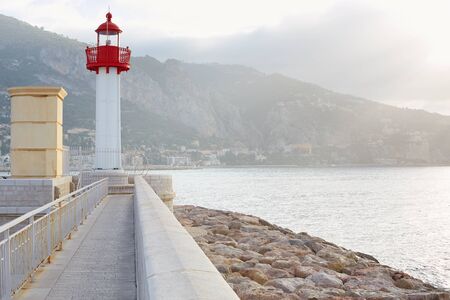 Lighthouse on the mediterranean coast in the morningの写真素材