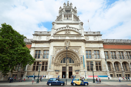 LONDON - AUGUST 7: Victoria and Albert museum facade with people walking on August 7, 2015 in London, UK. The museum hosts the world's largest collection of decorative art and design.のeditorial素材