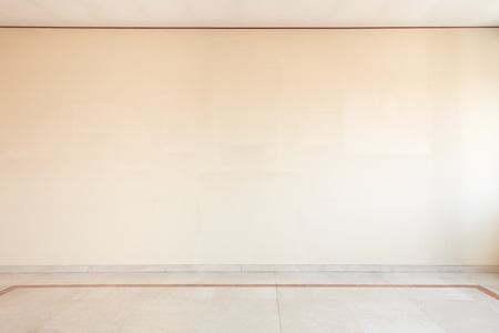 Empty room with marble floor and white blank wallの写真素材