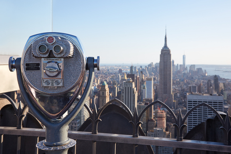 Binoculars on Rockefeller Center with Empire State Building and city view at the end of the day on September 12, 2016 in New York. The observation deck on top of the skyscraper is calledのeditorial素材