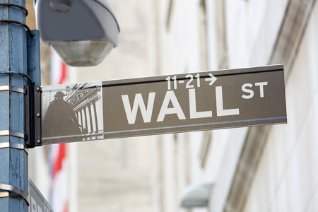 Wall Street sign with street lamp near Stock Exchange, financial district in New York in a sunny dayのeditorial素材