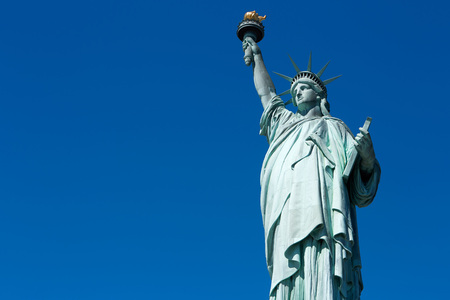 Statue of Liberty in a sunny day, blue sky blank spaceのeditorial素材