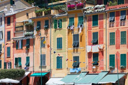 Portofino typical beautiful village with colorful buildings in Italy, Liguria in a sunny dayの写真素材